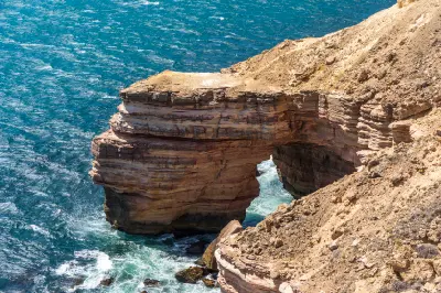 Natural Bridge forms a sandstone arch above the Indian Ocean on the rugged Kalbarri coast.