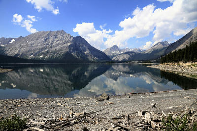 Upper Kananaskis Lake with mountain reflections and shoreline in Alberta, Canada.