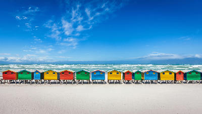Colourful beach huts at Muizenberg Beach, Cape Town, South Africa.