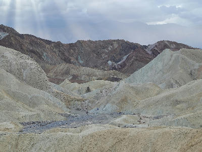 Gower Gulch badlands wash with hikers Death Valley California