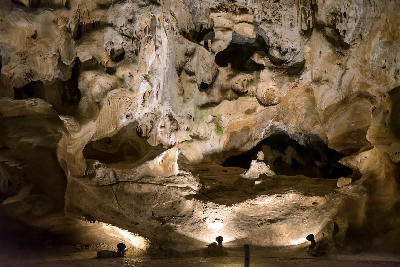Illuminated limestone flowstone and cave wall formations inside the Cango Caves near Oudtshoorn in the Western Cape of South Africa.