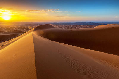 Sunrise over the sand dunes of Erg Chebbi in the Sahara Desert near Merzouga, Morocco.