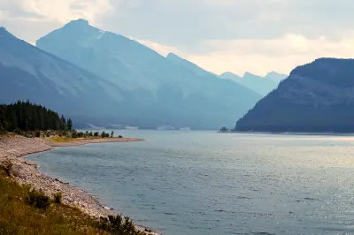 Spray Lakes with curved shoreline and mountain valley in Alberta, Canada.