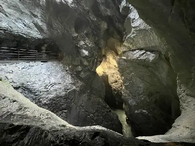 Trümmelbach Falls moving through narrow rock chambers with walkway inside a mountain in Lauterbrunnen Switzerland