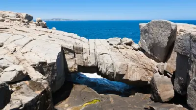 Natural Bridge spans a narrow opening in the granite coastline of Torndirrup National Park, sculpted by the powerful Southern Ocean near Albany.