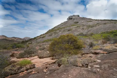 Granite slopes and coastal heath below the summit of Frenchman Peak in Cape Le Grand National Park, Western Australia.