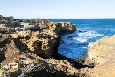 Viewing platform and rugged limestone coastline above The Grotto on the Great Ocean Road, Victoria.