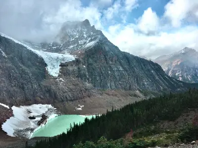 Angel Glacier on Mount Edith Cavell above turquoise Cavell Pond in Jasper National Park