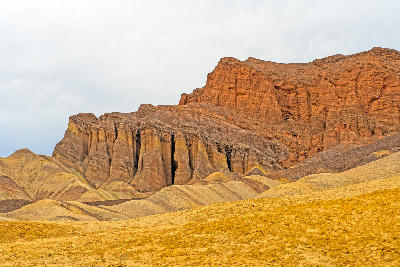 Eroded rock columns and desert hills in Golden Canyon near Zabriskie Point Death Valley