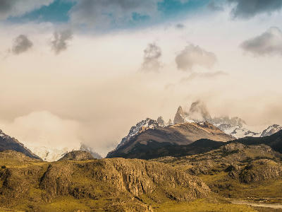 Mount Fitz Roy partially covered by clouds seen from Mirador de los Cóndores above El Chaltén in Patagonia, Argentina.