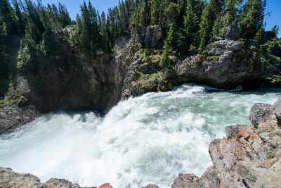 Water surging over the edge at the Brink of the Upper Falls in the Yellowstone River canyon