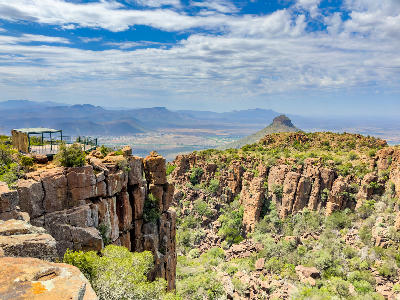 Valley of Desolation dolerite cliffs and viewing platform overlooking the Karoo near Graaff-Reinet in Camdeboo National Park, South Africa.