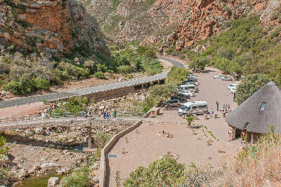View over the parking and picnic area at Meiringspoort from the trail to Meiringspoort Waterfall in the Swartberg mountain canyon of South Africa.