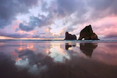 Wharariki Beach and Archway Islands at sunset, South Island, New Zealand