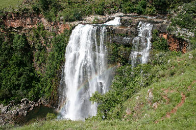 Lisbon Falls in Mpumalanga cascading into a plunge pool below forested cliffs along the Panorama Route.