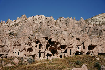 Rock-cut cave dwellings and volcanic cliffs at Zelve Open Air Museum in Cappadocia, Turkey, forming one of the region's largest historic cave settlements.