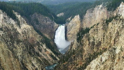 Lower Falls of the Yellowstone River from Artist Point showing canyon depth and river below
