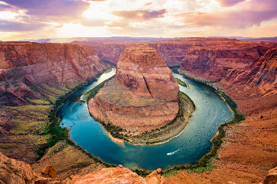 Horseshoe Bend with Colorado River curving around sandstone formation at sunset, Page, Arizona, USA