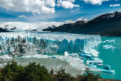 Perito Moreno Glacier ice wall with turquoise water and floating icebergs in Los Glaciares National Park near El Calafate, Patagonia, Argentina.