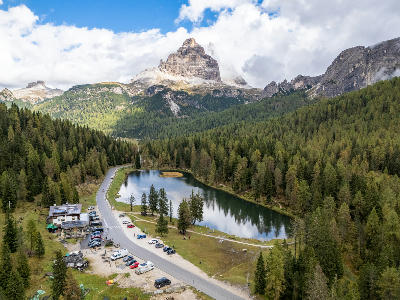 Aerial view of Lago d’Antorno, a small mountain lake set within the Dolomites in northern Italy.