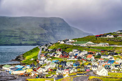 Eiði village with colorful houses and coastal cliffs on Streymoy, Faroe Islands.