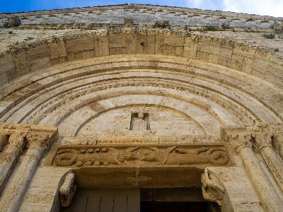 Architrave carved with two crocodiles, at the Collegiate church of San Quirico, San Quirico d'Orcia