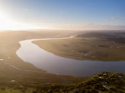 Aerial view of the Touw River Estuary, lagoon and wetlands extending inland near Wilderness on South Africa's Garden Route.