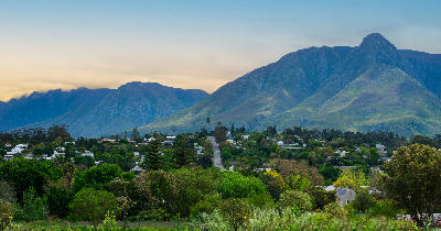 Panoramic view of Swellendam surrounded by greenery beneath the Langeberg Mountains in the Western Cape, South Africa.