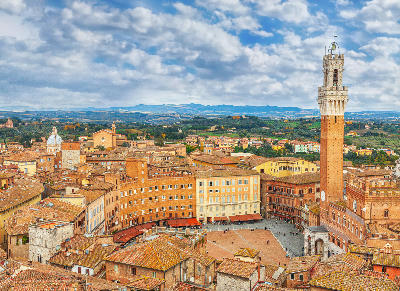 High-angle view of Siena, showing Torre del Mangia, Piazza del Campo, and the Palazzo Pubblico in the historic centre.