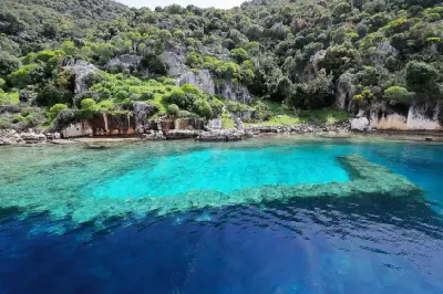 Ancient submerged ruins visible through turquoise water along the coast of Kekova Island, Turkey.
