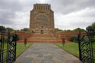 Front view of the Voortrekker Monument in Pretoria with terraced gardens and central staircase leading to the entrance.