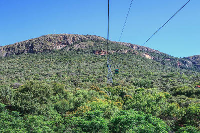 The Hartbeespoort Aerial Cableway climbs the slopes of the Magaliesberg, carrying visitors from the valley floor to panoramic viewpoints overlooking Hartbeespoort Dam and the surrounding mountains.