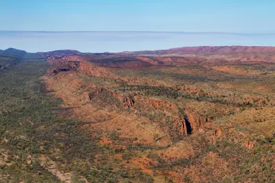 Elevated view across rugged red ridges and valleys near Glen Helen in the West MacDonnell Ranges.