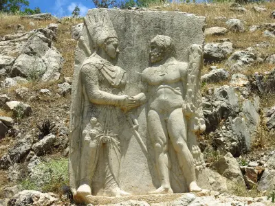 Full stone relief of King Antiochus I shaking hands with Heracles at ancient Arsameia, Turkey.