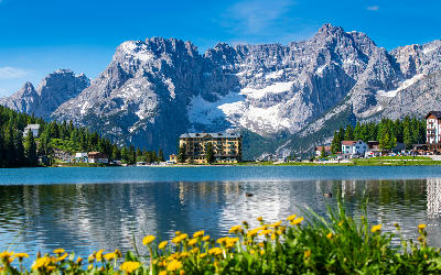 Lago di Misurina in the Dolomites, with calm alpine water surrounded by mountain peaks in northern Italy.