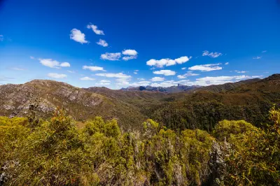 Mountain wilderness and distant Frenchmans Cap viewed from Donaghys Hill, Tasmania.