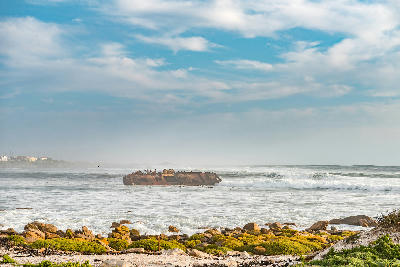 The wreck of the Jahleel offshore at Hondeklip Bay, with cormorants resting on the remains of the vessel.