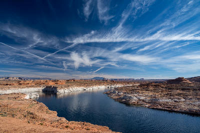 Lake Powell shoreline narrow channel sandstone desert mesas cloud streaks Glen Canyon Arizona Utah