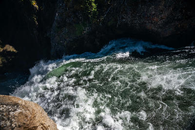Fast-moving water at the brink of the Lower Falls just before it drops into the Yellowstone canyon