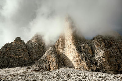  Three Peaks of Lavaredo in morning fog. National Park Tre Cime di Lavaredo, Dolomite Alps mountains, Trentino Alto Adige region, Sudtirol, Dolomites, Italy