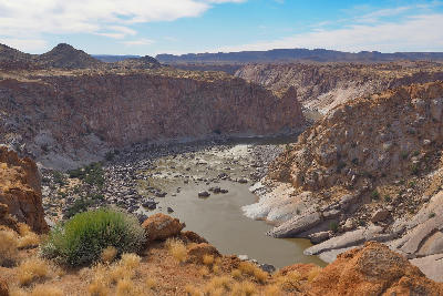 View from Ararat Viewpoint across the Orange River Gorge and towering granite canyon walls in Augrabies Falls National Park, South Africa.