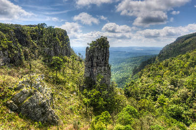 Pinnacle Rock quartzite tower rising above indigenous forest and escarpment valleys on the Panorama Route near Graskop, Mpumalanga, South Africa.