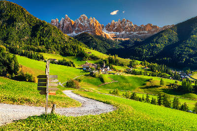 Santa Maddalena village in Val di Funes, with the Dolomites mountains rising in the background, Trentino-Alto Adige, Italy.