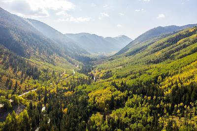 Maroon Creek Valley with autumn aspens and winding river in Aspen Colorado