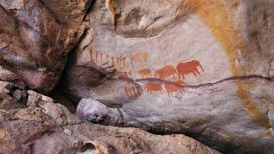 Ancient San rock art painted on a sandstone shelter along the Sevilla Rock Art Trail in the Cederberg Mountains, South Africa.