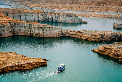 Lake Powell houseboat sandstone canyon channels Glen Canyon Utah Arizona shoreline
