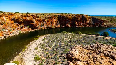 Yardie Creek winds between rugged red limestone cliffs in Cape Range National Park.