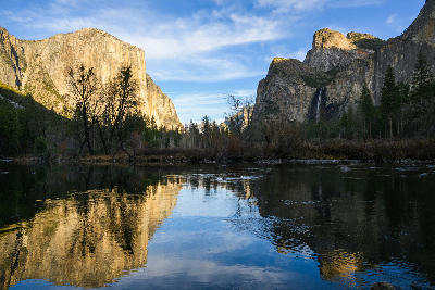 Valley View Yosemite with El Capitan and Bridalveil Fall reflected in the Merced River under soft evening light.