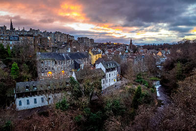 Dean Village and the Water of Leith viewed from Dean Bridge at sunset in Edinburgh.