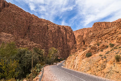 Road leading into the towering canyon walls of Todra Gorge in Morocco